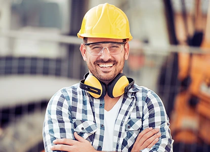 a construction worker wearing a hard hat and headphones