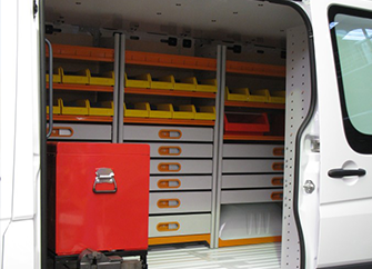 a van with a red storage boxes and shelves fit out